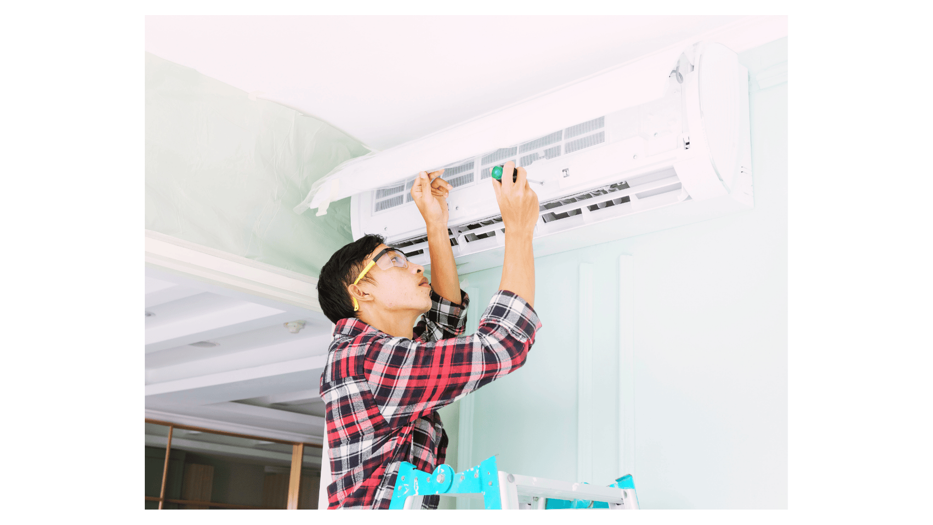 Air conditioning contractor Perth technician servicing a wall-mounted split system air conditioner